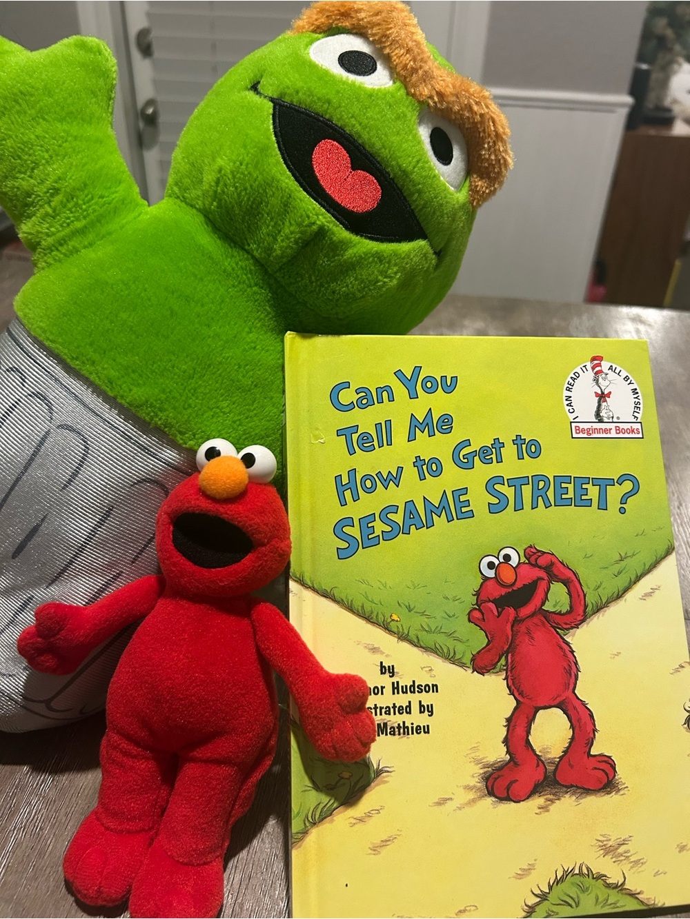 Elmo hardcover book Oscar plush and Elmo finger puppet